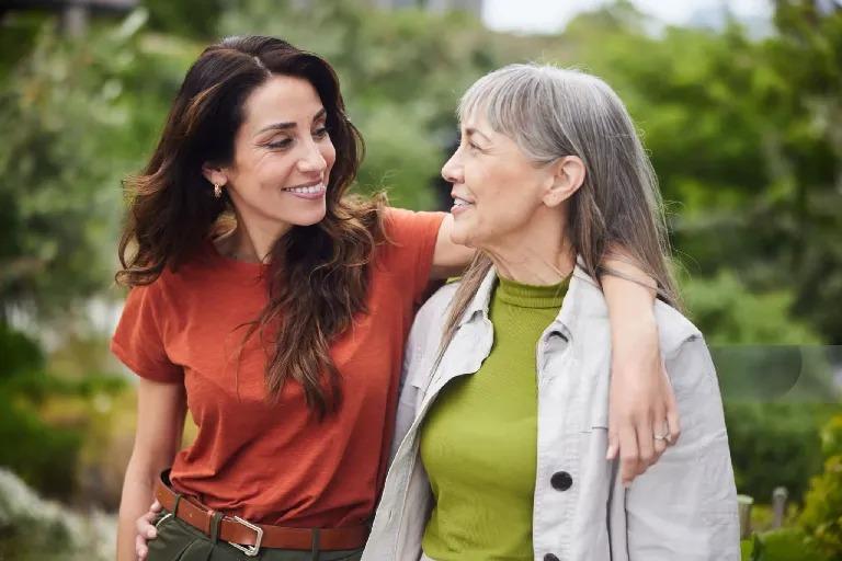 Daughter sharing a laugh with her mother at home
