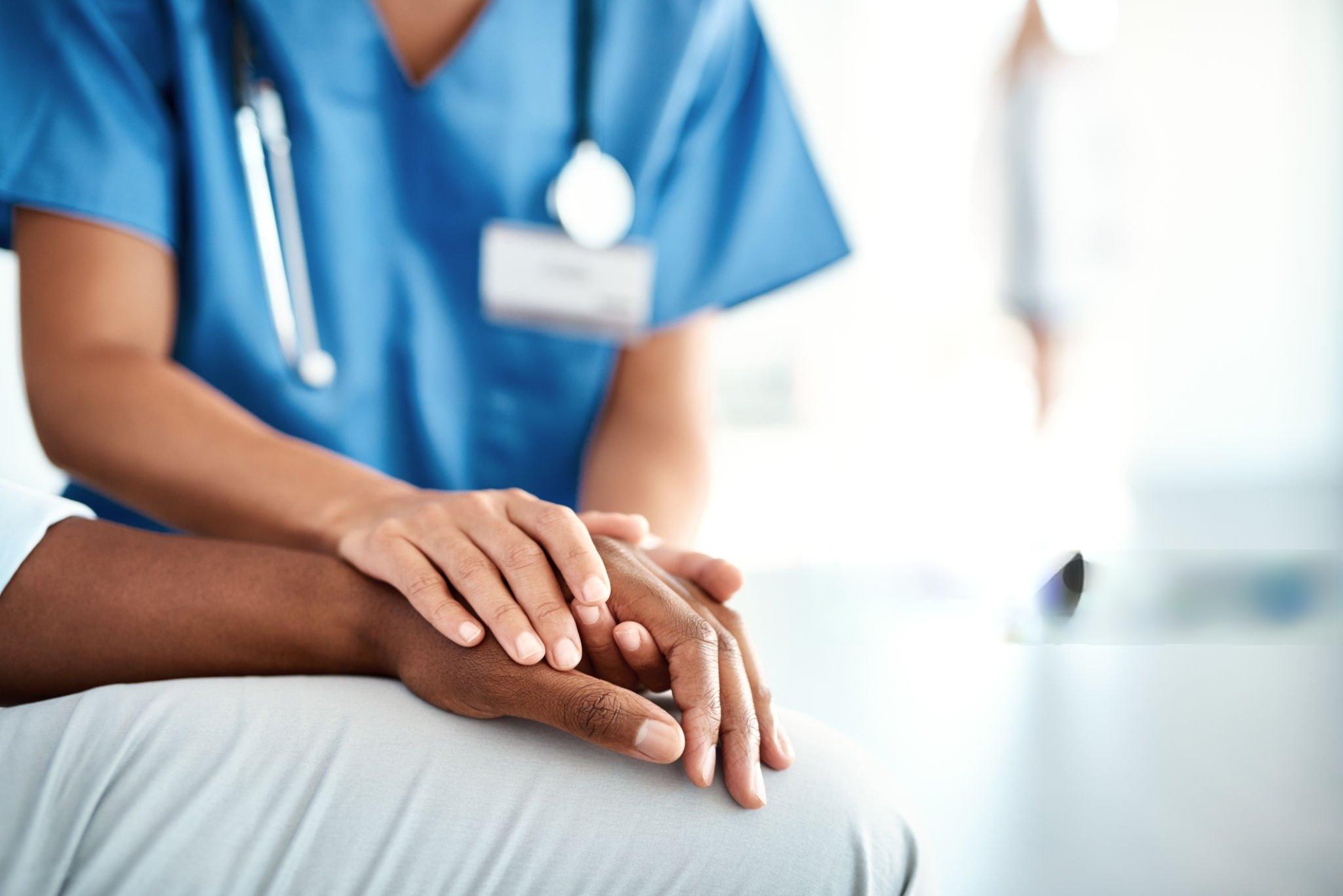 Care coordinator reviewing a chronic-condition plan with a family caregiver