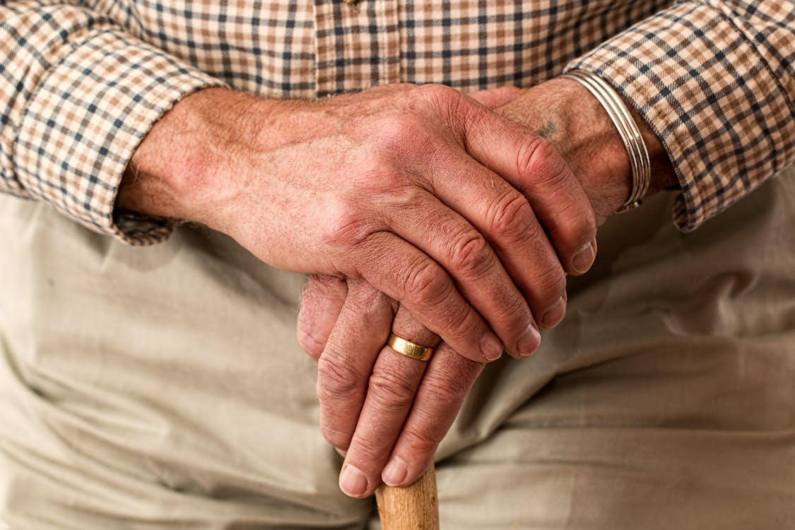 Senior person holding a cane