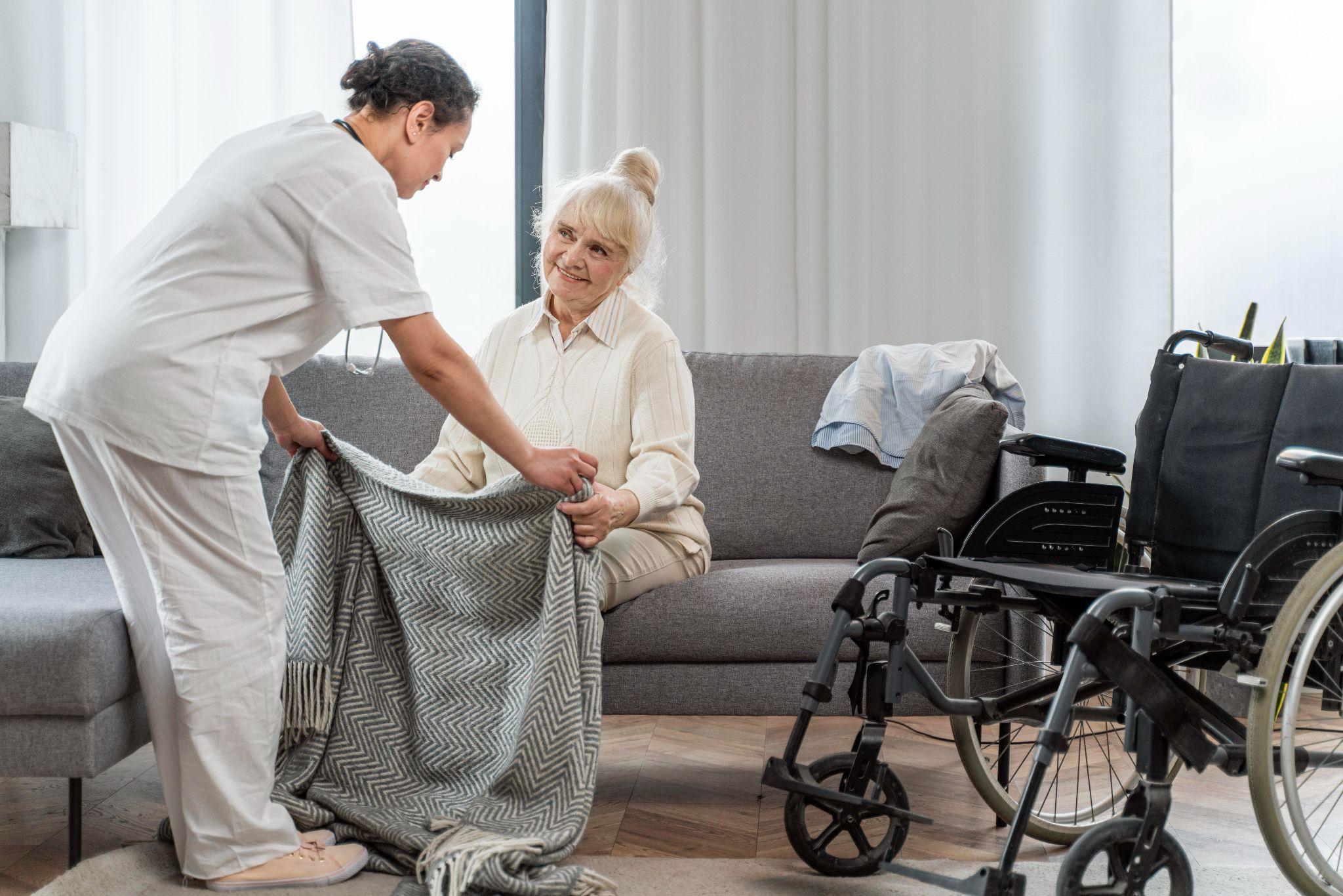 Caregiver assisting an older adult with daily personal care at home, demonstrating how personal care services in New Jersey support comfort, safety, and independence.