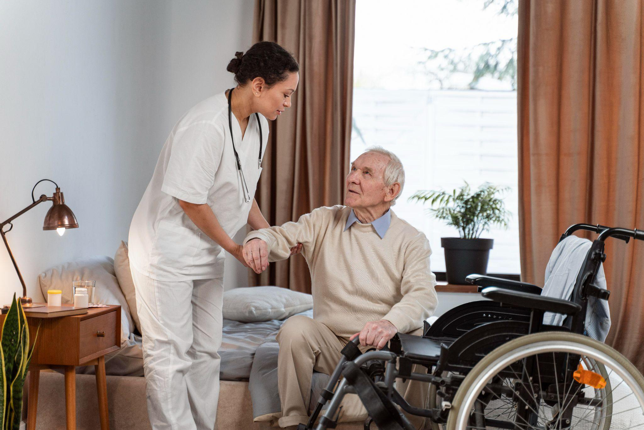 Home health aide helping an older adult with mobility and daily routines at home as part of personalized senior care in New Jersey.