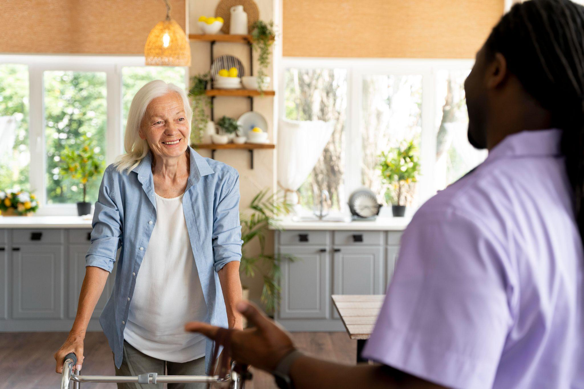 Home health aide in New Jersey engaging with a senior during an in-home care visit